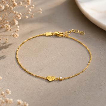Gouden armband met vingerafdruk op hartje